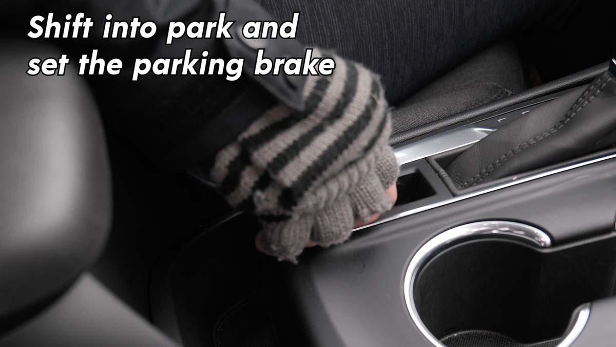 Shift into park and set the parking brake