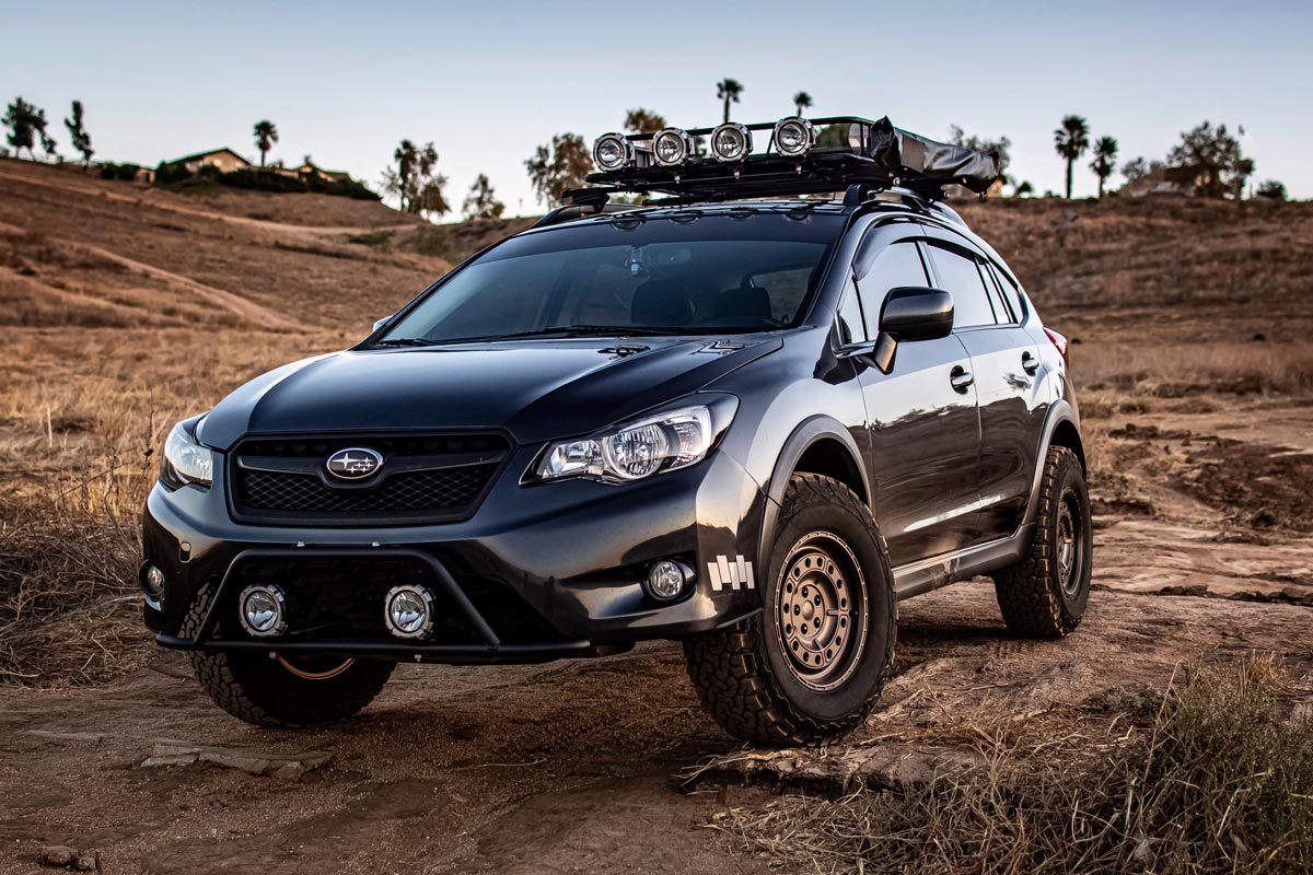 Black Subaru Crosstrek outfitted for overlanding in the desert