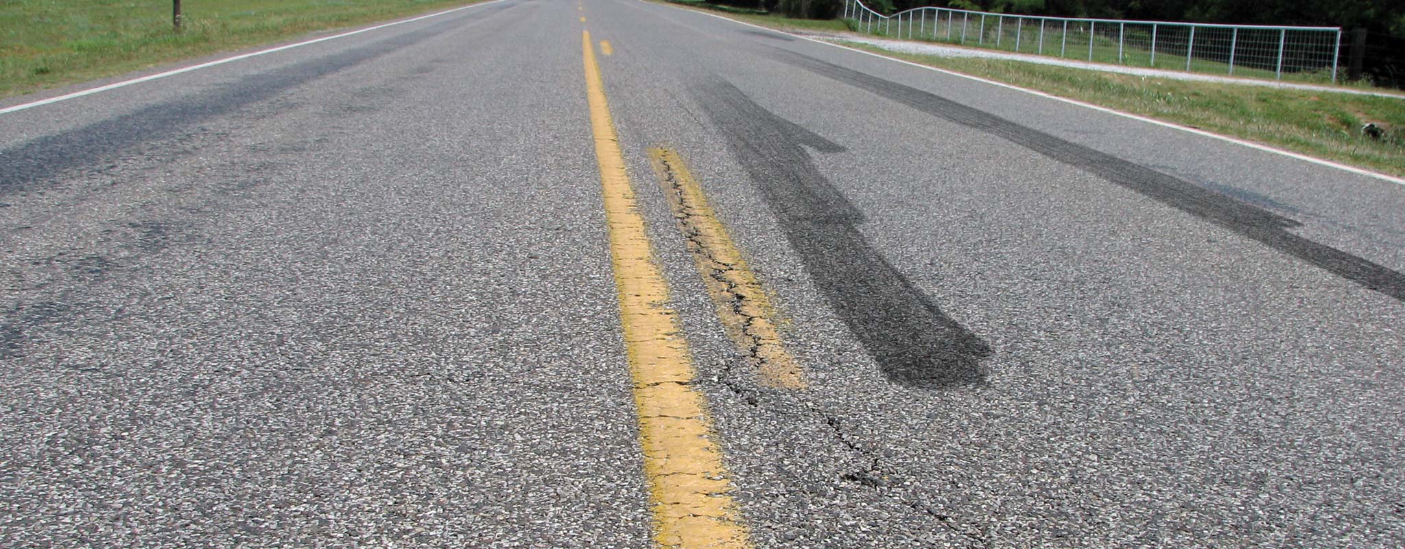Tire skid marks on a rural road.