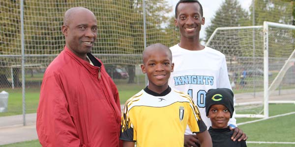 Felix Songolo of the varsity boys’ soccer team at De La Salle North Catholic High School with some family members.